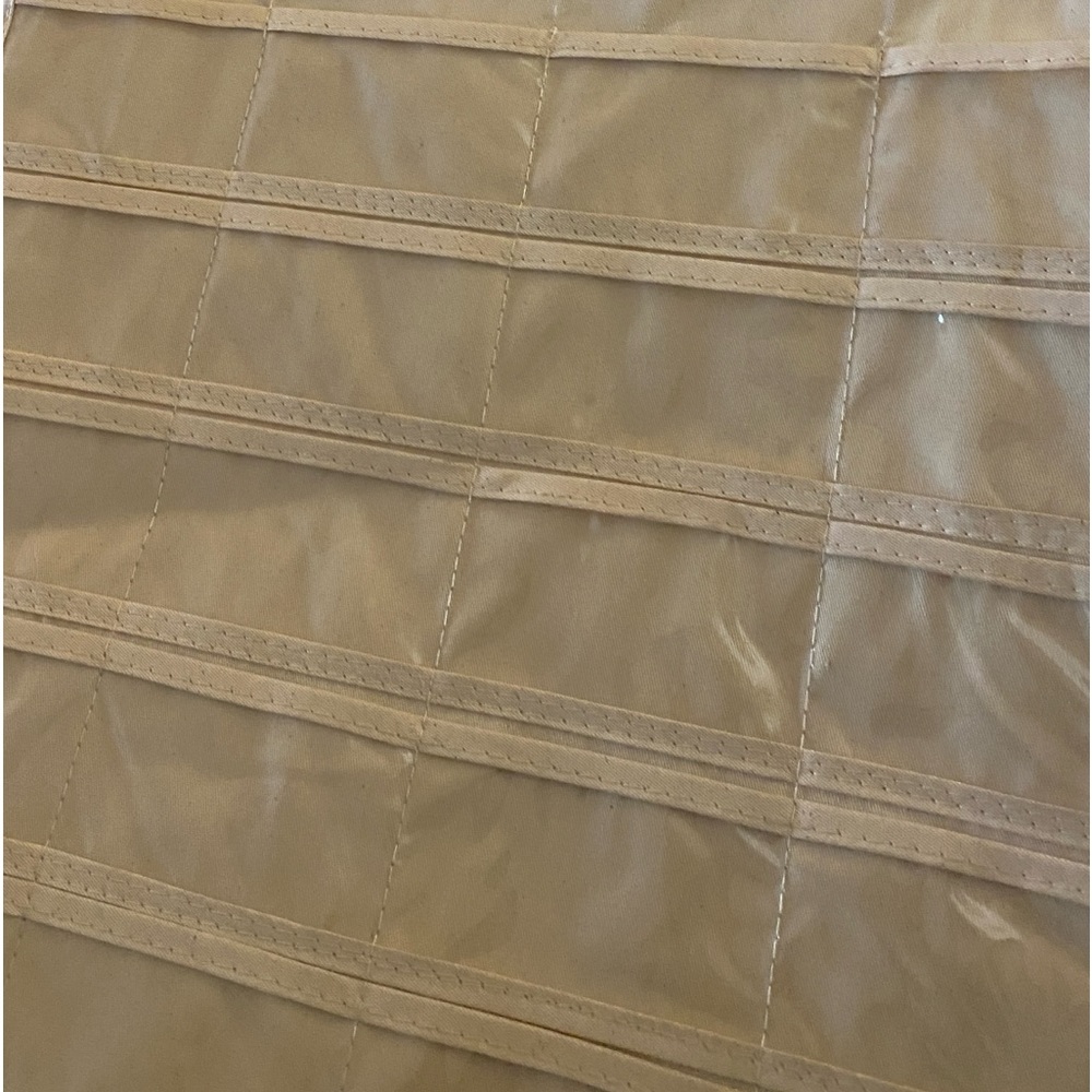 Hanging organizer, never used. Plastic inserts, canvas base.